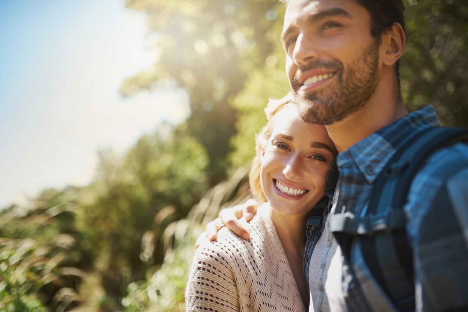 Smiling couple embracing outdoors. Smiling couple embracing outdoors.
